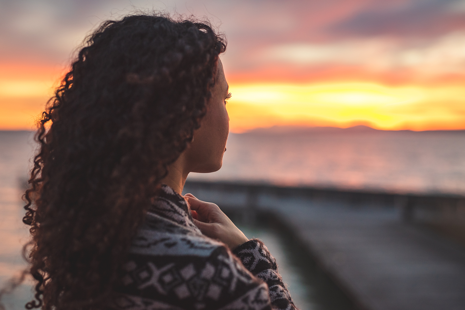 Image of person looking into the distance. This image could depict someone who is considering what to do for mental health awareness month in North Carolina. Begin your therapy journey with an online therapist in North Carolina, too! 28374 | 28403 | 27705
