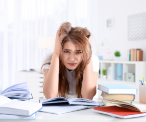 Young female student struggling with studying. If the transtion to college life has left you overwhelmed and unsure of where to turn, counseling for college students in New Bern, NC is here to help you get back on track.