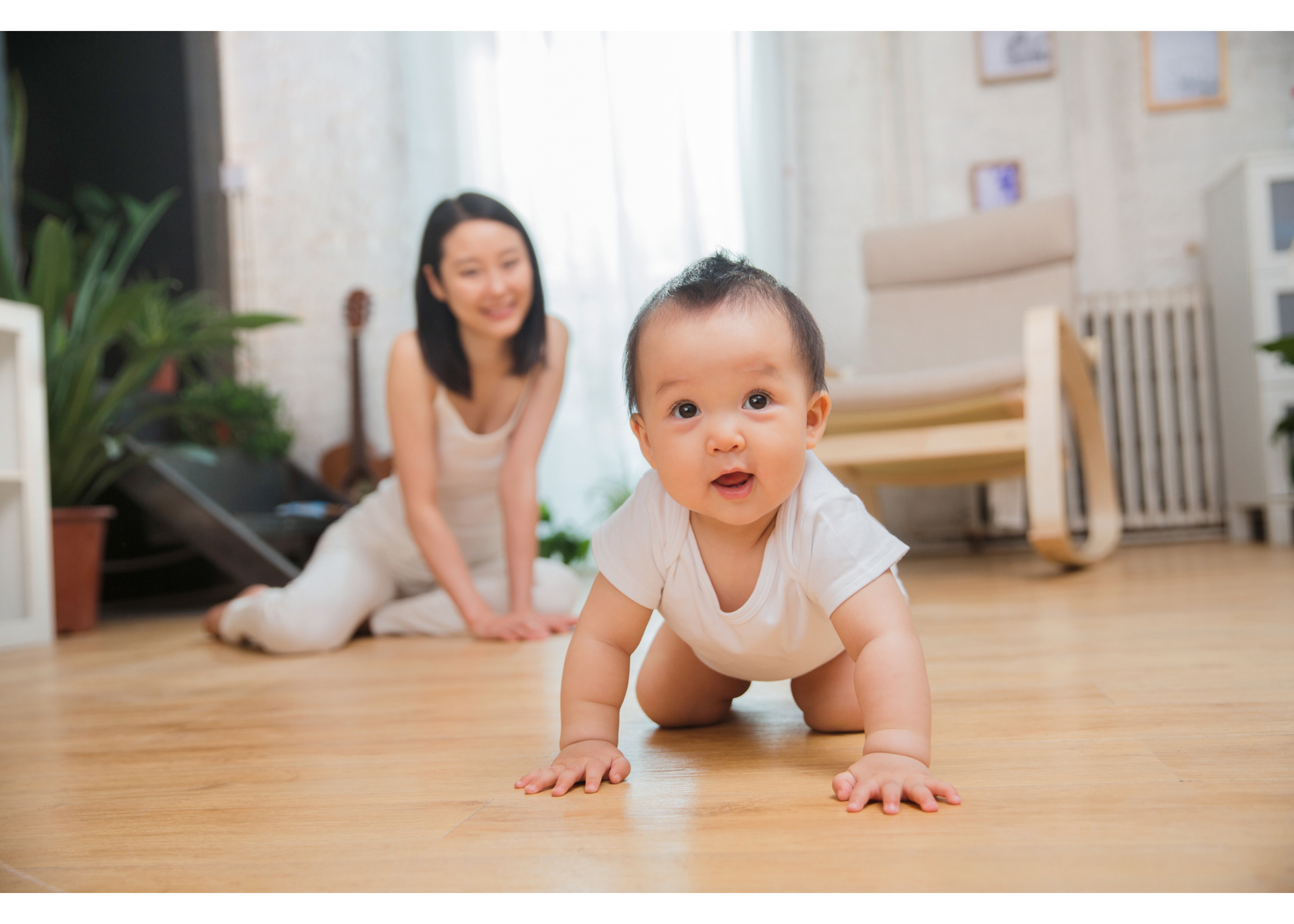 A mom happily watches her baby crawl on the floor representing someone who has used therapy to improve their postpartum mental health. Online therapy for women in North Carolina can help you win this fight! Learn more here.