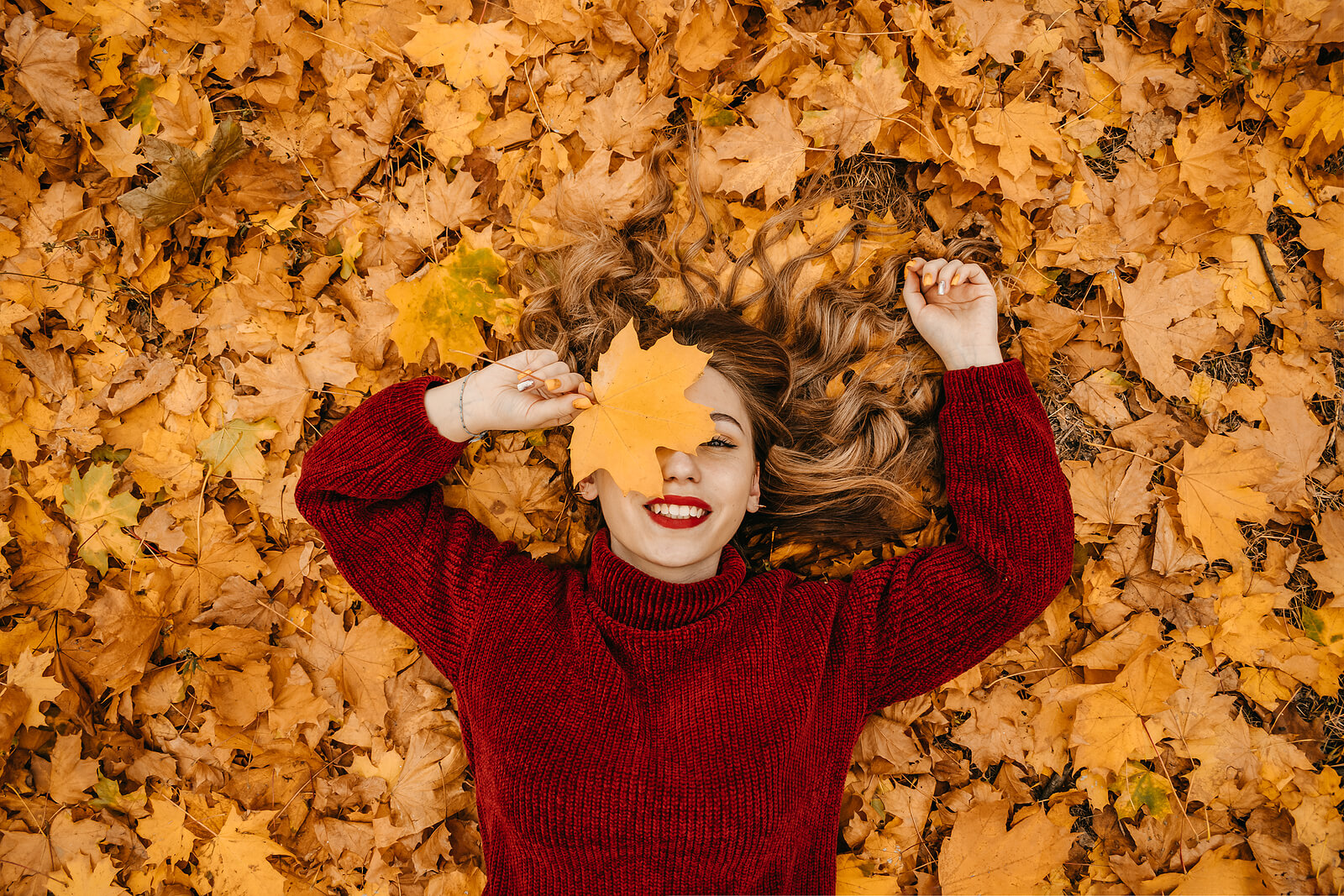 Woman enjoying a beautiful fall day. You can overcome Seasonal Affective Disorder with the help from an online therapist in North Carolina. Stop living in the shadows! Learn more here.