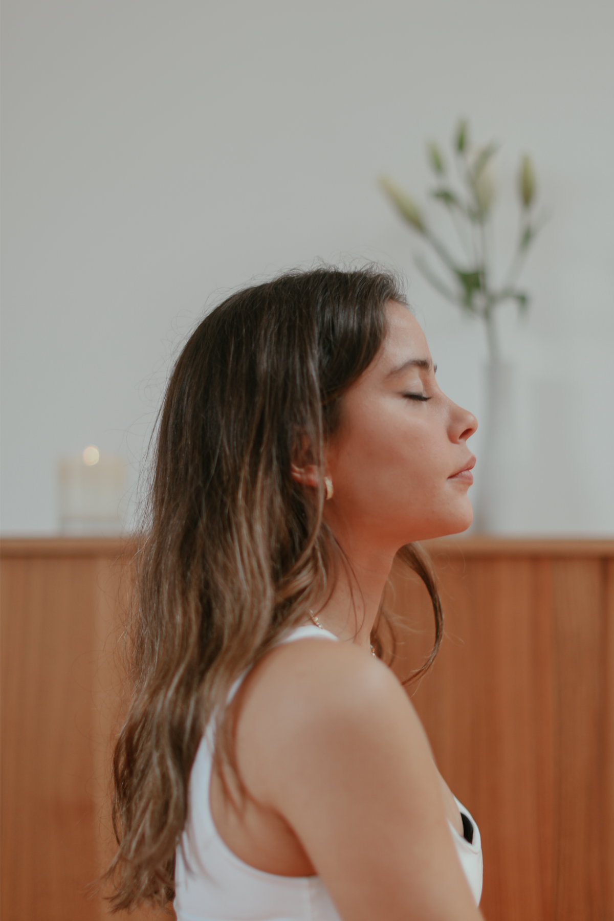 A woman closes her eyes while listening to her surroundings. This could symbolize the peace that mindfulness can bring. Learn tips for mental wellness in North Carolina and how therapy for anxiety in New Bern, NC can offer support this holiday season. 