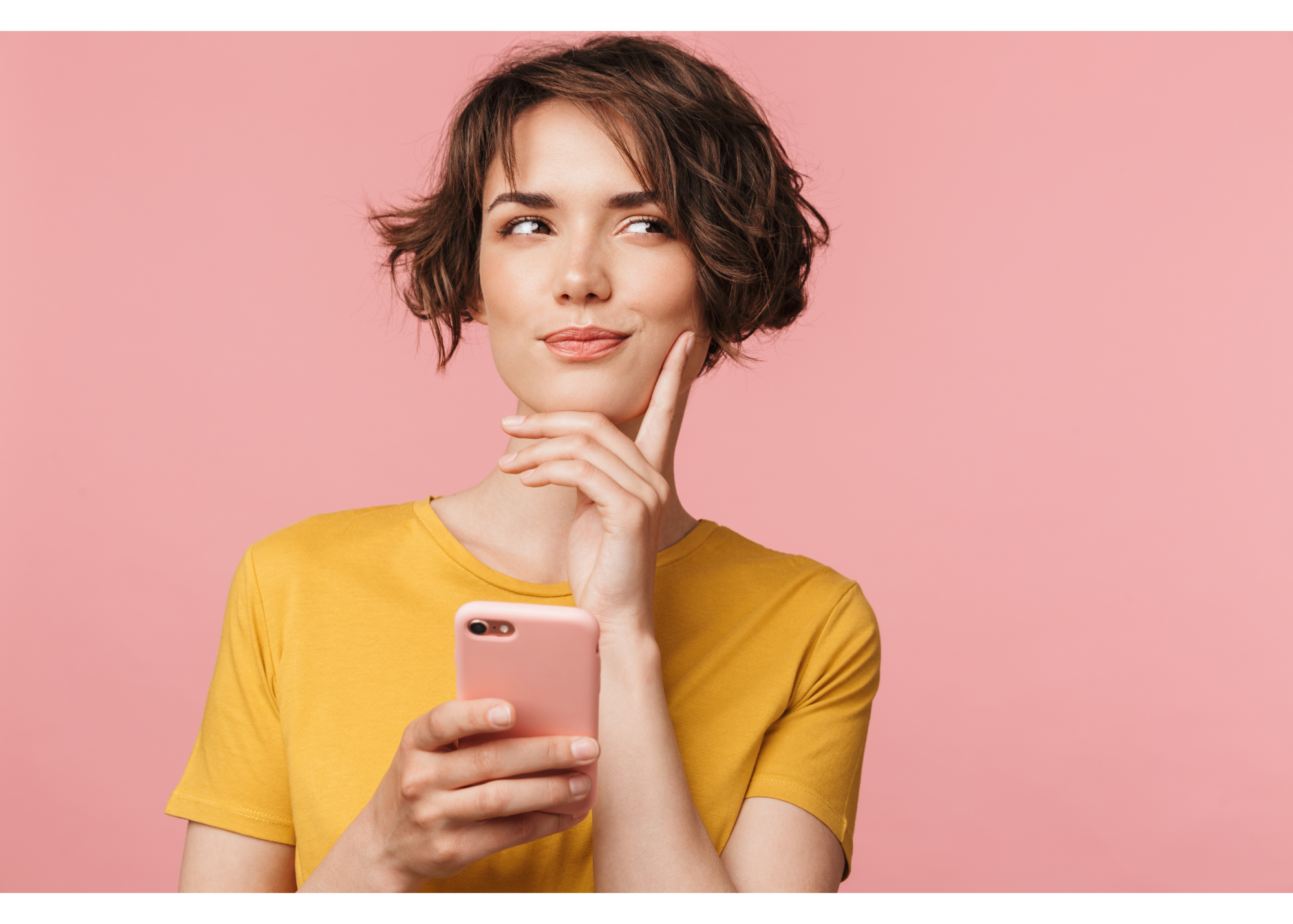 A woman holds her phone while looking away with a pensive look. This could symbolize the improving flexible thinking skills cultivated by working with a New Bern therapist. Learn more about therapy for anxiety in New Bern, NC and the support it can offer.