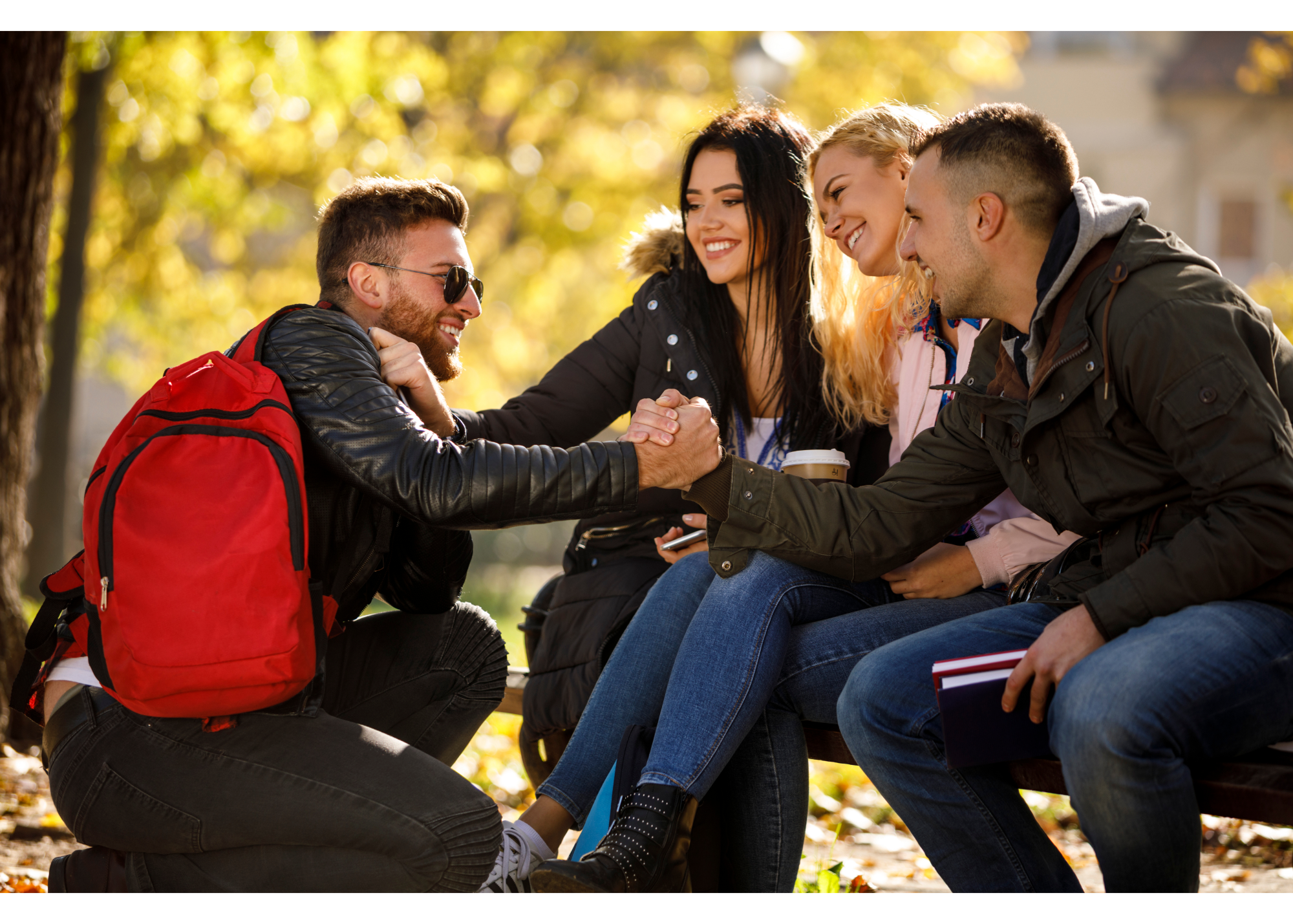 Three adults sit on a bench while shaking the hand of a smiling man. This could represent introducing one’s self to new friends. Learn how life changes counseling in North Carolina can offer support for making new friends by contacting a therapist in New Bern, NC. They can offer online therapy in North Carolina and other services. 