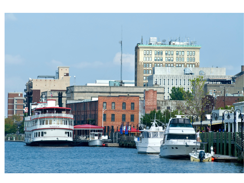 An image of a waterway next to a downtown setting. Learn more about therapy for anxiety in New Bern, NC, and the support a therapist in New Bern, NC can offer. 