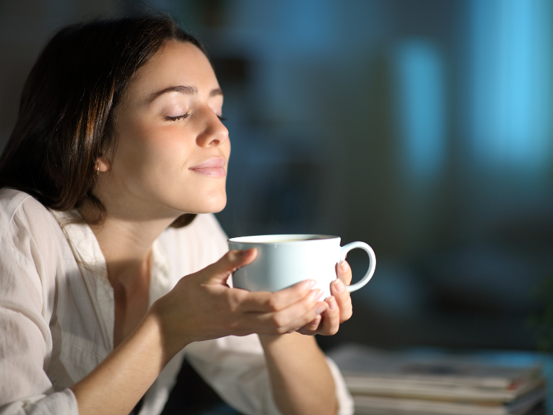 A close up of a woman with eyes closed smelling a coffee with a smile. Learn how a New Bern therapist can offer support with being mindful. Search for online therapy North Carolina to learn more about online therapy in North Carolina and more.
