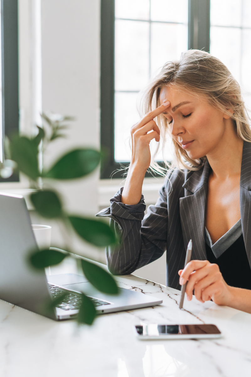Frustrated women at computer at work. Find Relief from stress and anxiety. Discover the Power of Online Therapy in North Carolina