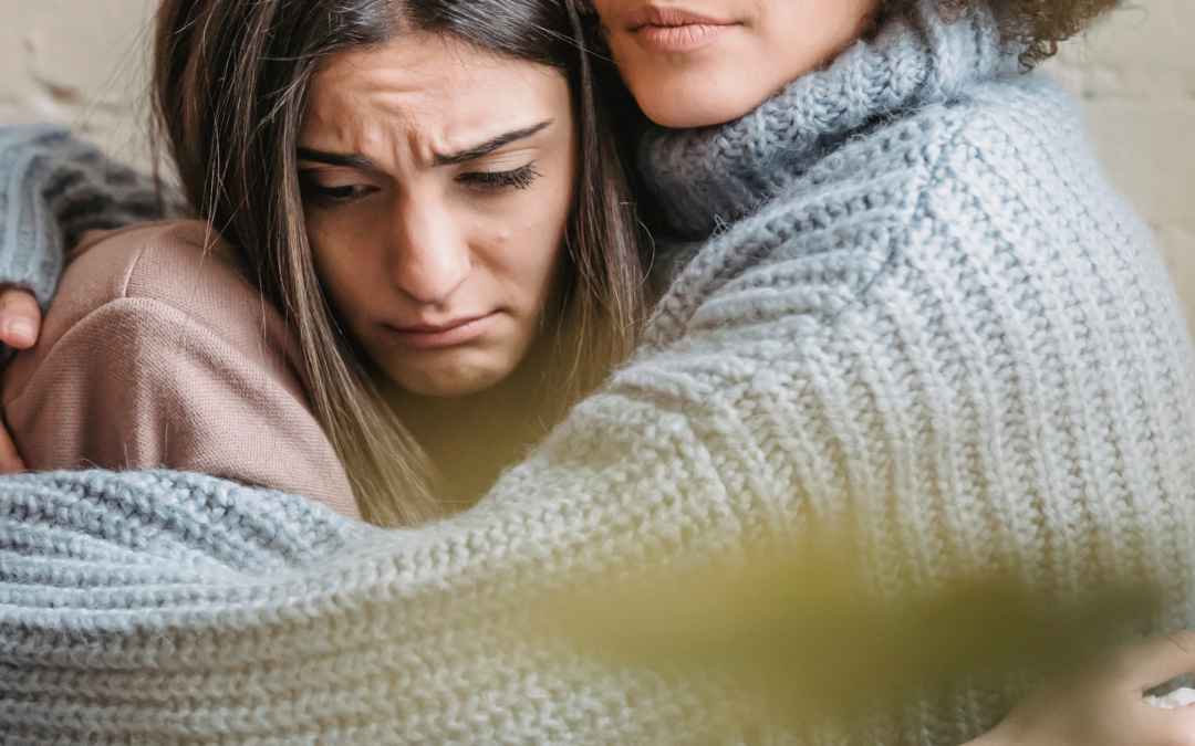 woman hugging another woman with depression. Online Therapy. New Bern, NC