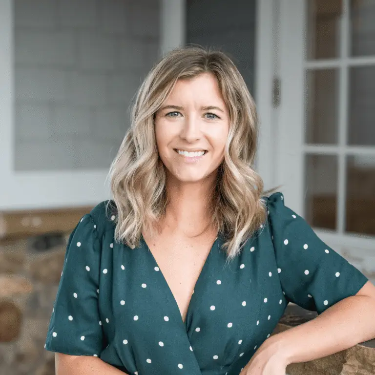 Alyssa Hermanson, LCSW, smiling in a green polka dot dress — accepting new telehealth clients in North Carolina.