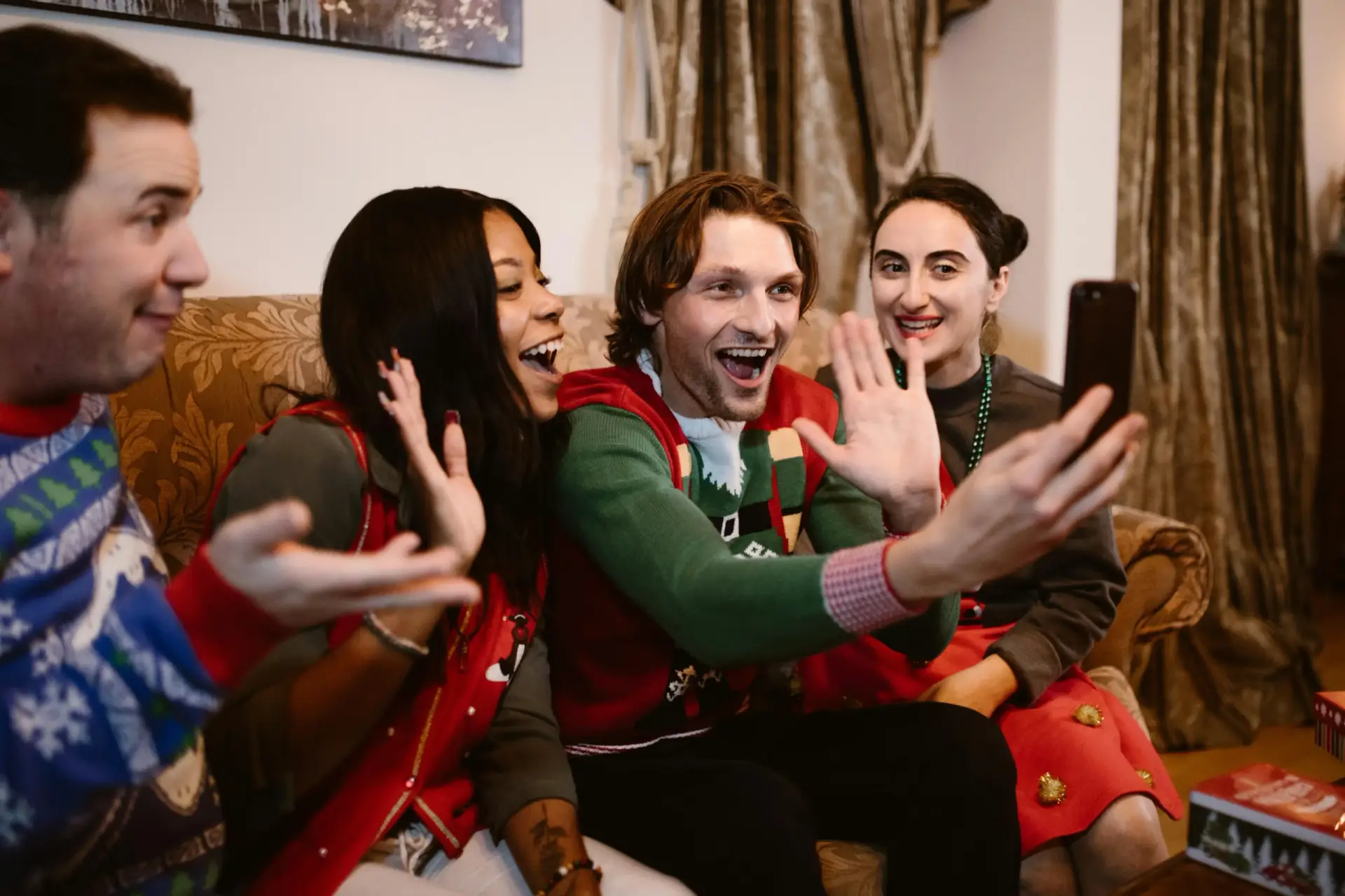 Group of friends taking a holiday selfie, showing joy and connection.