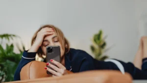Person reading a stressful message from an ex on their phone
