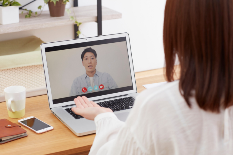 Man talking with a therapist during an online therapy session
